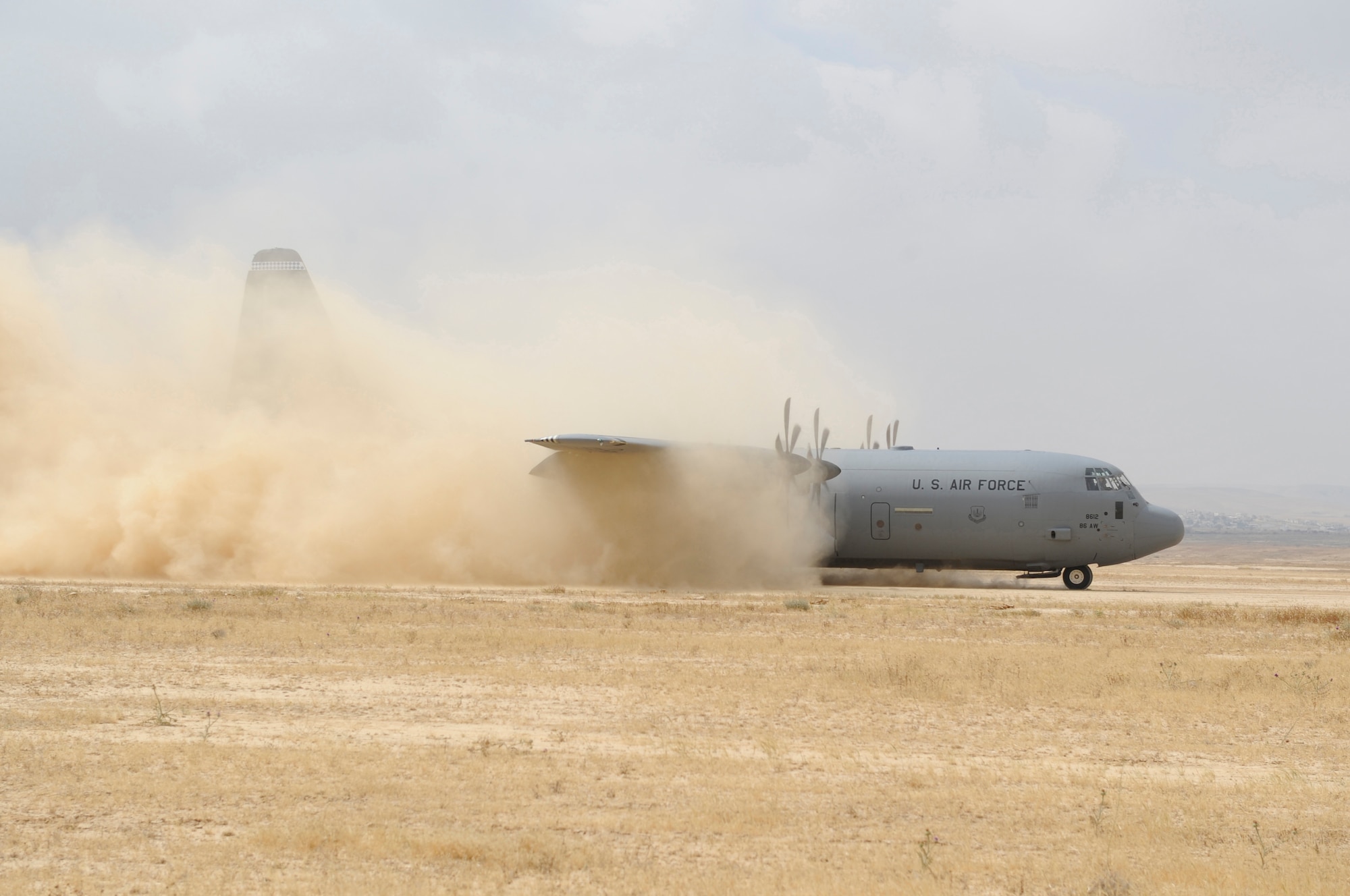 A C-130J Hercules assigned to the 37th Airlift Squadron, Ramstein Air Base, Germany, preforms a max effort assault zone landing during Exercise Noble Shirley 2015, May 10, 2015.  The max effort assault zone landing gives the pilot the ability to practice landing in austere conditions in a controlled environment. (U.S. Air Force photo/Tech. Sgt. Patrick Mitchell)