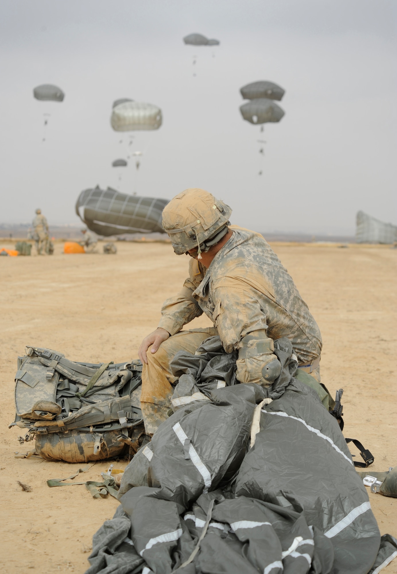 A solider from the Headquarters and Headquarters Company 173rd Brigade Special Troops Battalion (Airborne) completes a 1,100ft. combat equipment jump during Exercise Noble Shirley 2015, May 10, 2015.  With an Israeli jump master directing the jump, the HHC 173rd BSTB soldiers were able to earn Israeli jump wings - a rare opportunity. (U.S. Air Force photo/Tech. Sgt. Patrick Mitchell)