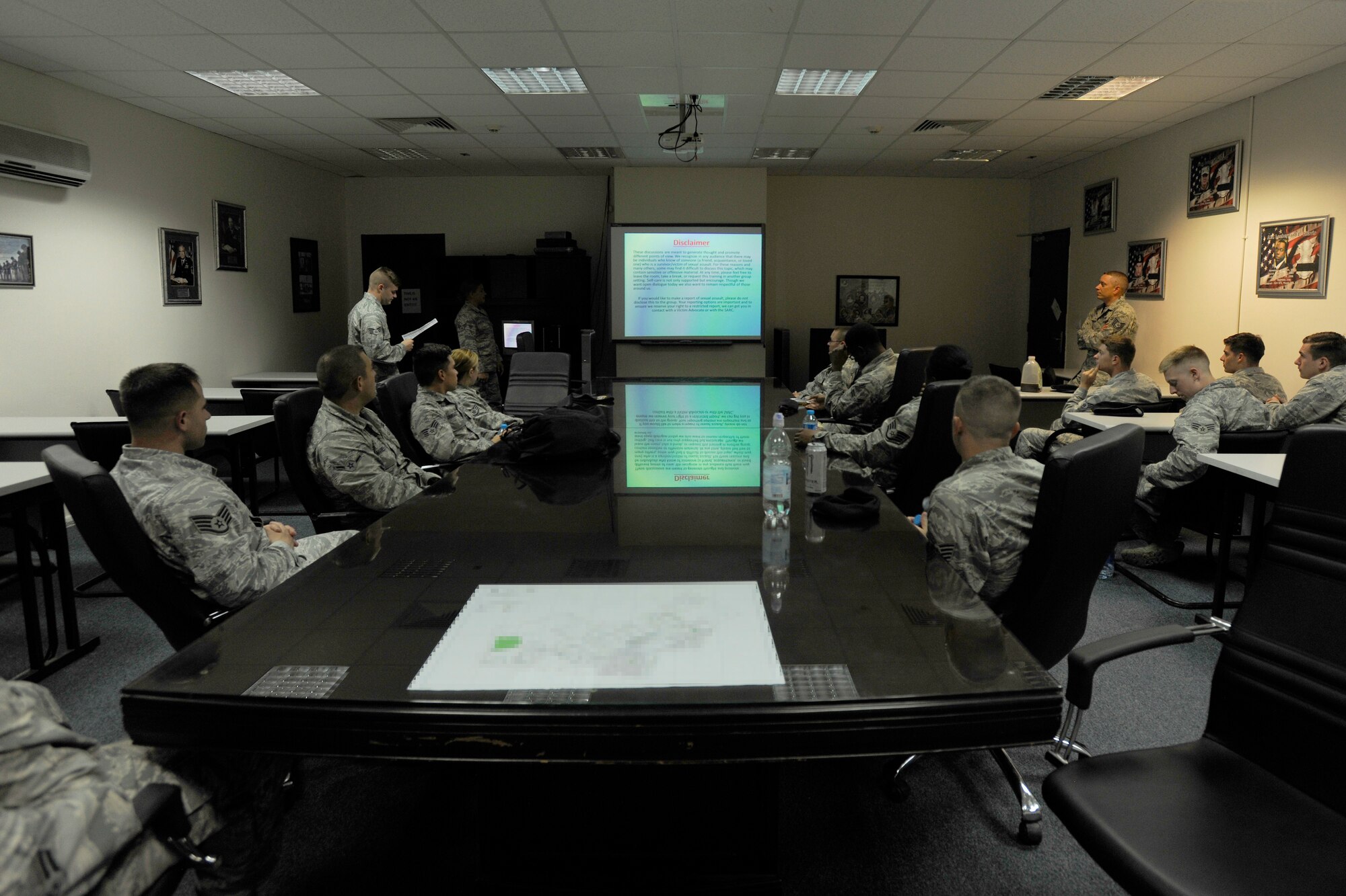 Airmen from the 39th Security Forces Squadron listen to a Sexual Assault and Prevention briefing May 18, 2015, at Incirlik Air Base, Turkey.  Airmen across the Air Force participated in a 90-minute training as well as completed additional small group training on a variety of topics related to sexual assault. (U.S. Air Force photo by Senior Airman Krystal Ardrey/Released)