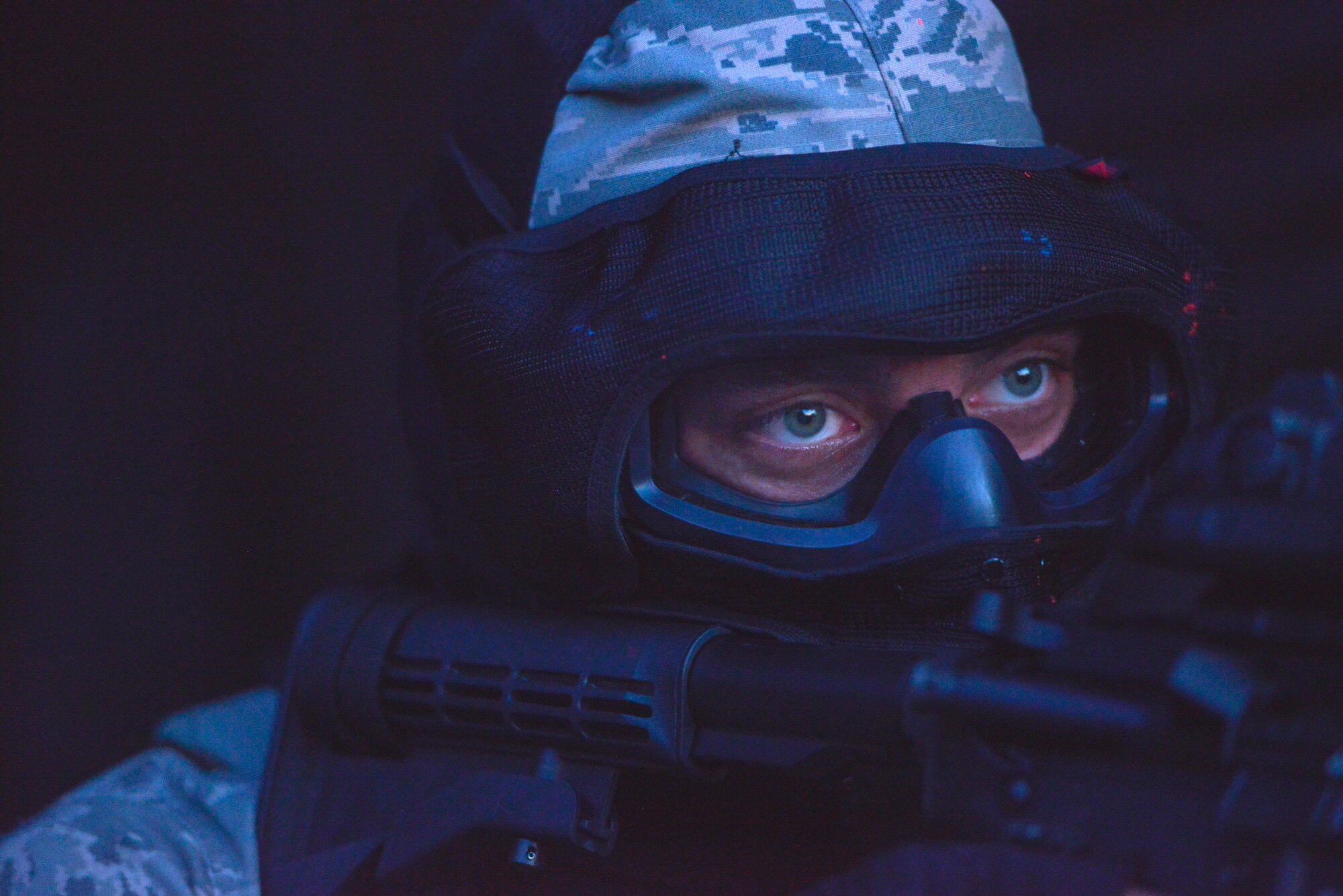 A U.S. Airman covers a corner of a hangar as his team advances in a training exercise during Battlefield Leaders Assaulter Course, Integrated Combat Essentials May 30, 2015, at Ramstein Air Base, Germany. BLAC ICE is a 12-day-training regimen that brings together several countries to train with U.S. Air Force security forces members on advanced tactics, shooting and leadership skills. (U.S. Air Force photo by Airman 1st Class Lane T. Plummer/Released)