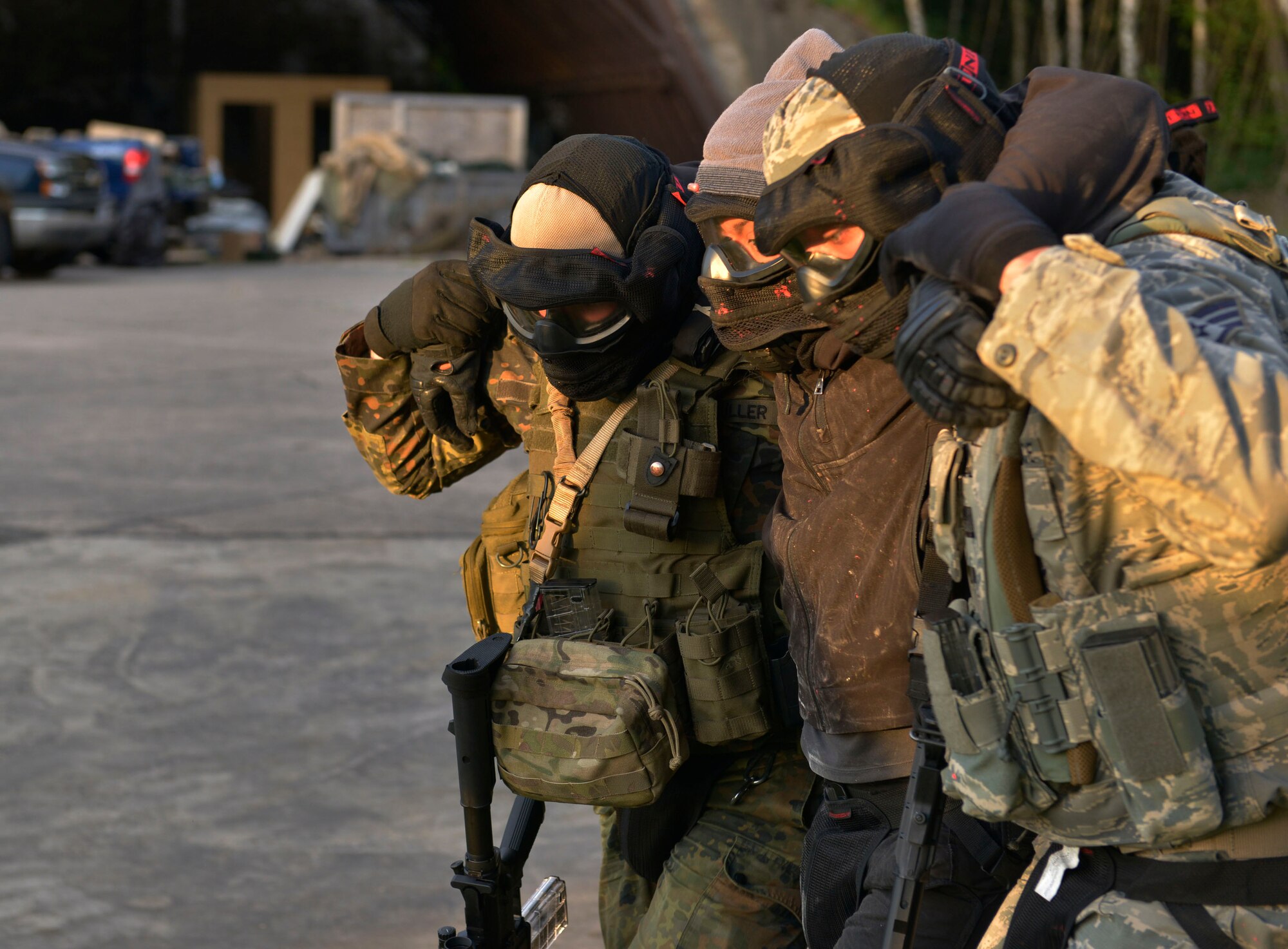 Two U.S. Airmen carry out another Airman  simulating as an opposing force member during Battlefield Leaders Assaulter Course, Integrated Combat Essentials May 30, 2015, at Ramstein Air Base, Germany. The BLAC ICE training brings together U.S. Air Force security forces members with Belgium, Germany, the Netherlands and Italy security forces to train on advanced tactics, such as properly removing dead bodies or incapacitated individuals. (U.S. Air Force photo by Airman 1st Class Lane T. Plummer/Released)