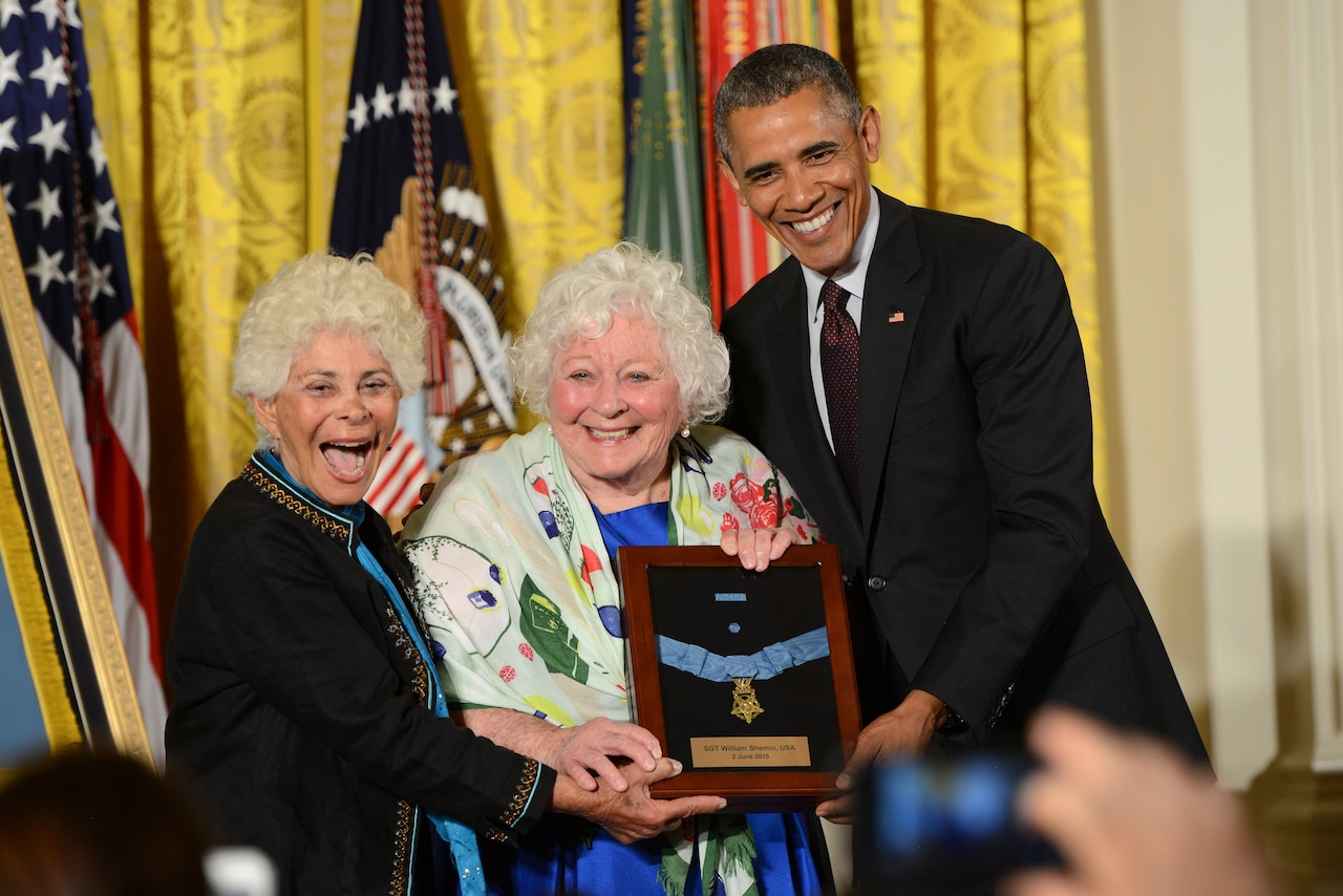 President Barack Obama presents Ina Bass, left, and Elsie Shemin-Roth with the Medal of Honor for their father, Army Sgt. William Shemin, at the White House, June 2, 2015. Shemin is credited with risking his life during World War I to save the lives of others. DOD photo by Lisa Ferdinando