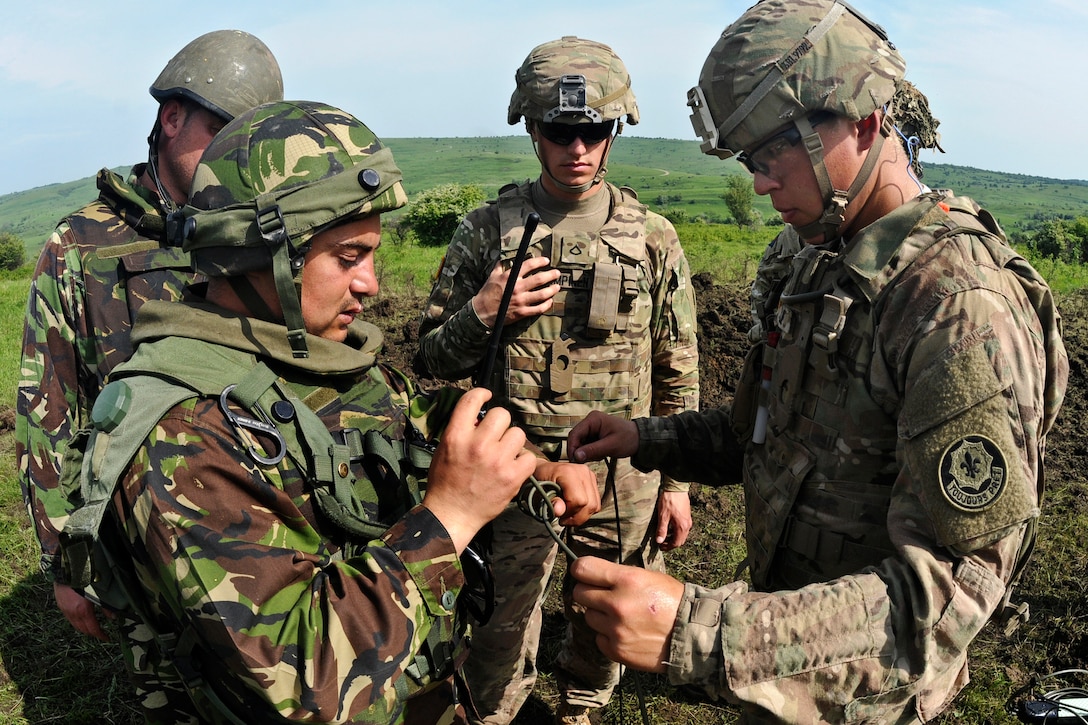 U.S. Army Pfc. Logan J. Lampinen, Center, An Infantryman Assigned To ...