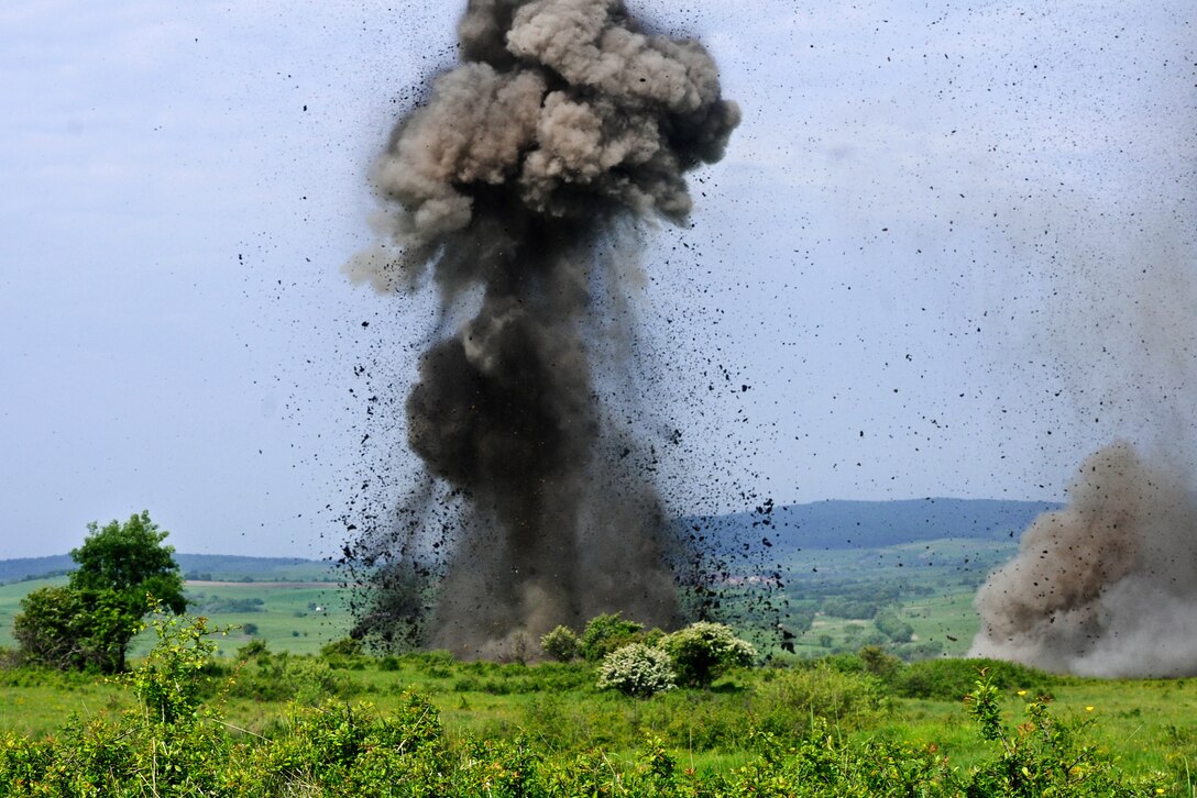 U.S., British and Romanian soldiers detonate 40-pound crater charges with C4 explosives during demolition training at the Cincu Training Center, Romania, May 22, 2015.