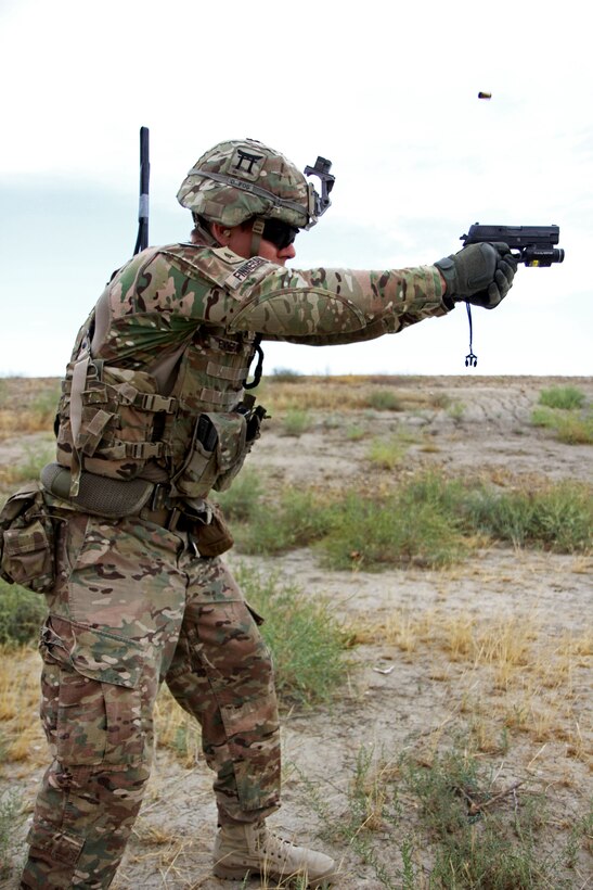 U.S. Army Sgt. Andrew Finneran fires a Sig Sauer pistol during partnered marksmanship live-fire training on Tactical Base Gamberi in eastern Afghanistan, May 29, 2015. Finneran is an infantryman assigned to the 101st Airborne Division.