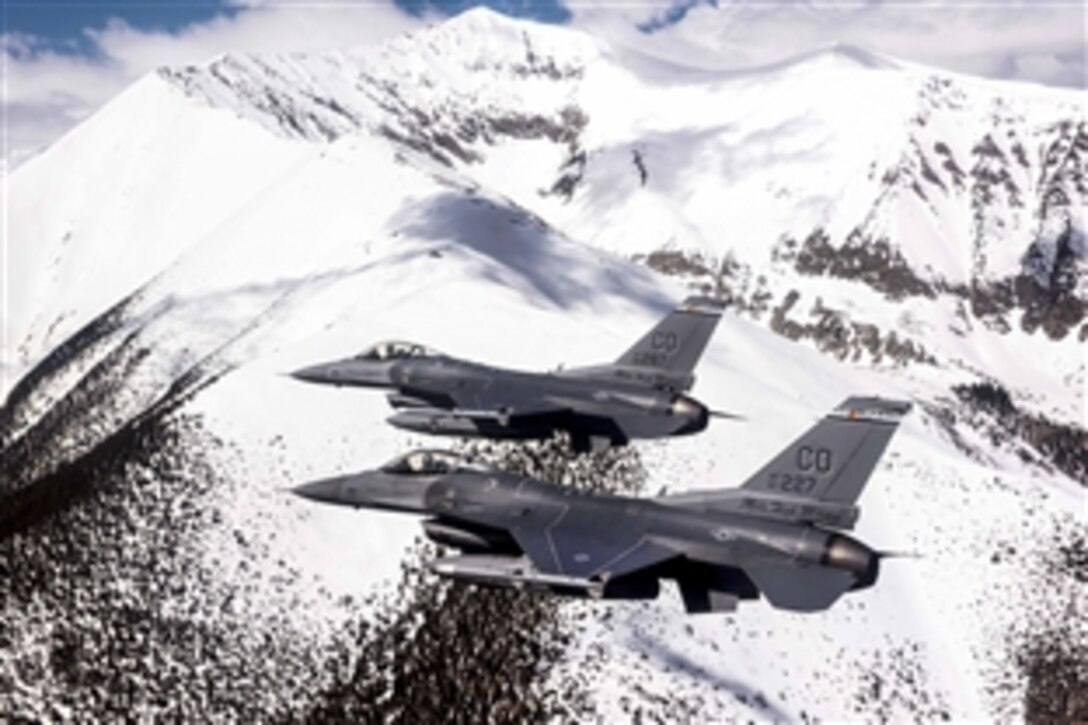 Air Force F-16 Fighting Falcons fly over the Rocky Mountains in Colorado, May 29, 2015, during a mission around the state. The pilots and aircraft are assigned to the Colorado Air National Guard's 120th Fighter Squadron.