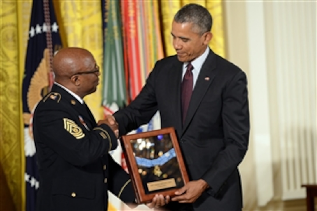 Command Sgt. Maj. Louis Wilson of the New York Army National Guard accepts a Medal of Honor on behalf of the late Pvt. Henry Johnson in a ceremony at the White House, June 2, 2015. Johnson, who served with the 369th Infantry Regiment, also known as the Harlem Hellfighters, received the award for heroic actions during World War I in France.