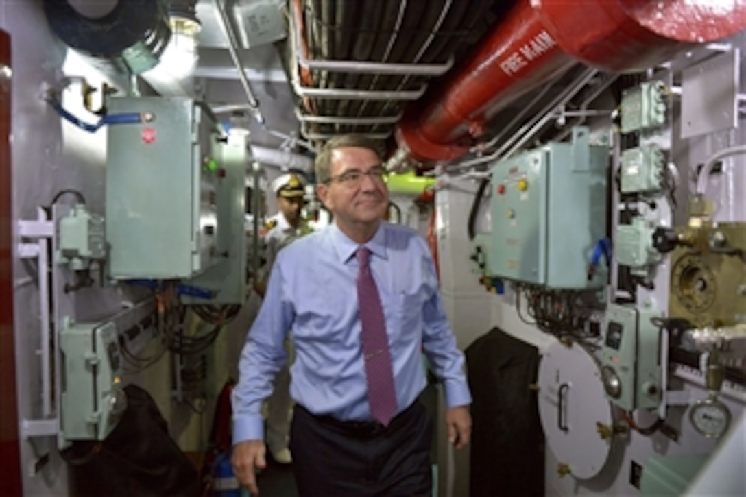U.S. Defense Secretary Ash Carter makes his way through the interior of the Indian Navy frigate INS Sahyadri as he tours the warship in Vizag, India, June 2, 2015. 