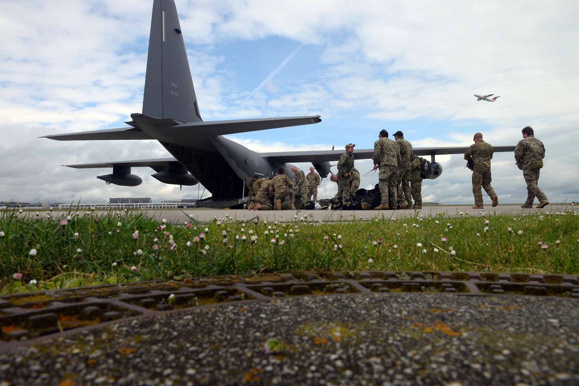 Operators from U.S. Special Operations Command -- Europe prepare prior their gear before a high-altitude, low-opening jump May 30, 2015, over Mont Saint-Michele, France. The paratroopers jumped from an MC-130J Commando II assigned to the 67th Special Operations Squadron from as high as 13,000 feet to commemorate the 71st anniversary of the liberation of France during World War II. (U.S. Air Force photo by Staff Sgt. Micaiah Anthony)
