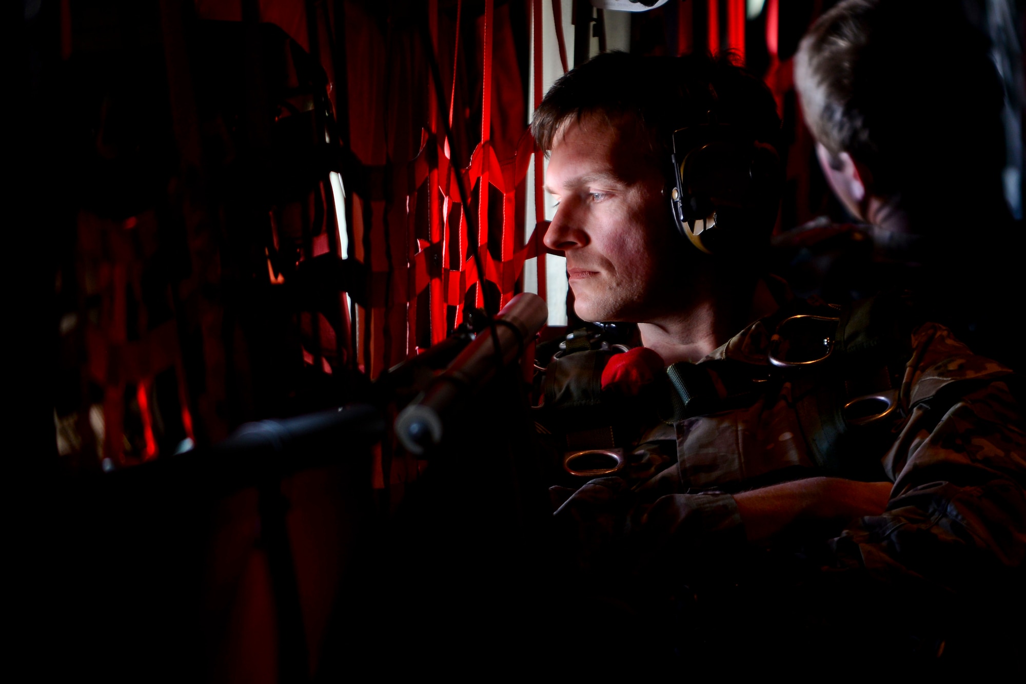 An operator from U.S. Special Operations Command -- Europe awaits the signal to prepare for the high-altitude, low-opening jump May 30, 2015, over Mont Saint-Michele, France. The paratroopers jumped from an MC-130J Commando II assigned to the 67th Special Operations Squadron from as high as 13,000 feet to commemorate the 71st anniversary of the liberation of France during World War II. (U.S. Air Force photo by Staff Sgt. Micaiah Anthony)