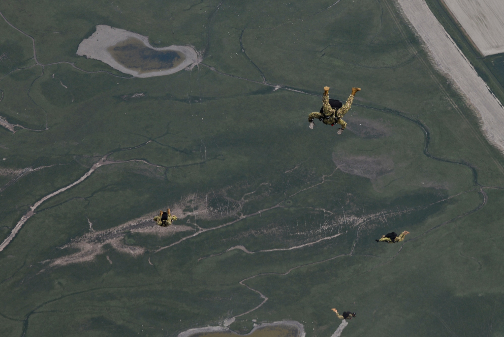 Operators from U.S. Special Operations Command -- Europe free fall during a high-altitude, low-opening jump May 30, 2015, over Mont Saint-Michele, France. The paratroopers jumped from an MC-130J Commando II assigned to the 67th Special Operations Squadron from as high as 13,000 feet to commemorate the 71st anniversary of the liberation of France during World War II. (U.S. Air Force photo by Staff Sgt. Micaiah Anthony)