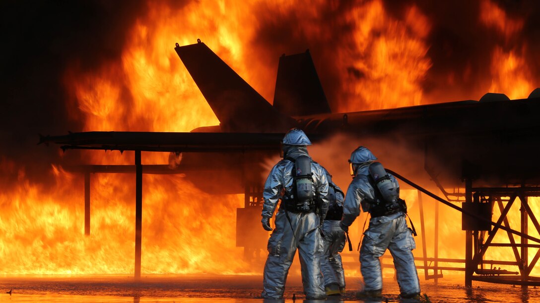 Marines with Aircraft Rescue and Fire Fighting battle the blaze as part of monthly training to ensure they are always prepared in the event of an emergency on the flight line. The ARFF Marines are a part of Headquarters and Headquarters Squadron aboard Marine Corps Air Station Beaufort.