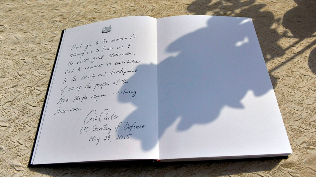 Secretary of Defense Ash Carter left wrote a note in the guestbook while visiting the National Museum of Singapore's Lee Kuan Yew Exhibit in Singapore, May 29, 2015.