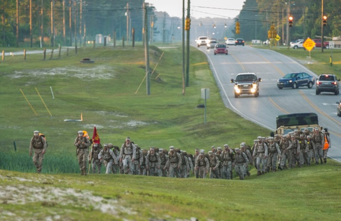 Marines with Electronics Maintenance Company, 2nd Maintenance Battalion, hike to the Battle Skills Training School to conduct the endurance course, aboard Camp Lejeune, N.C., May 29, 2015. ELMACO hiked approximately two miles to the school and then conducted the course to build camaraderie and say farewell to their commanding officer, Maj. Brian L. White. (U. S. Marine Corps photo by Cpl. Shawn Valosin)