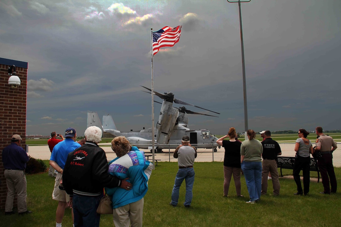 A crowd gathers to see the MV22 Osprey tiltrotor aircraft, which made stops at Owatonna, MN and Grand Forks, N.D., to showcase Marine Corps aviation technology and equimpment to the public, June 2. The Aircraft were flying from Marine Corps Air Station New River, N.C., to Marine Corps Air Station Yuma, AZ.