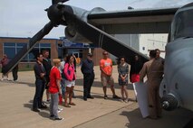 A crowd gathers to see the MV22 Osprey tiltrotor aircraft, which made stops at Owatonna, MN and Grand Forks, N.D., to showcase Marine Corps aviation technology and equimpment to the public, June 2. The Aircraft were flying from Marine Corps Air Station New River, N.C., to Marine Corps Air Station Yuma, AZ.