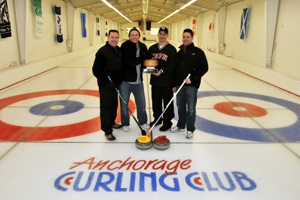 Members of the Air National Guard Curling team stand with their Top Rock
trophy Feb. 5, 2011, after the victory against the two-year Top Rock
champions, the Canadian team. The Canadian team went to the finals of the Top
Rock tournament in Anchorage to lose to the Air National Guard team 9-4.