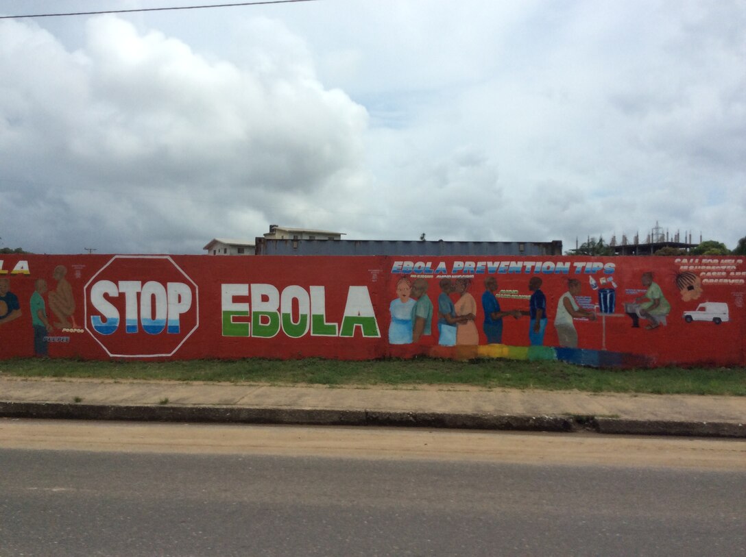 A banner found on the outskirts of Monrovia, Liberia during the Ebola outbreak that affected thousands of Liberians in 2014 and 2015. In October 2014 during the peak of the outbreak, Rivera deployed to hammer out leases and land-use agreements for Operation United Assistance, a humanitarian assistance mission aimed to combat the Ebola crisis in Liberia.