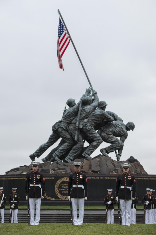 U.S. Marines with the Silent Drill Platoon perform during the sunset parade at the Marine Corps War Memorial, Arlington, Va., June 2, 2015. Mr. Bob Simmons, majority staff director, House Armed Services Committee, and Paul Arcangeli, minority staff director, House Armed Services Committee, were guests of honor for the parade, and Lt. Gen. Jon M. Davis, deputy commandant, Aviation, was the hosting official. Since September 1956, marching and musical units from Marine Barracks Washington, D.C., have been paying tribute to those who’s “Uncommon valor was a common virtue” by presenting sunset parades in the shadow of the 32-foot high figures of the United States Marine Corps War Memorial. (U.S. Marine Corps photo by Lance Cpl. Samantha K. Draughon/ Released)

