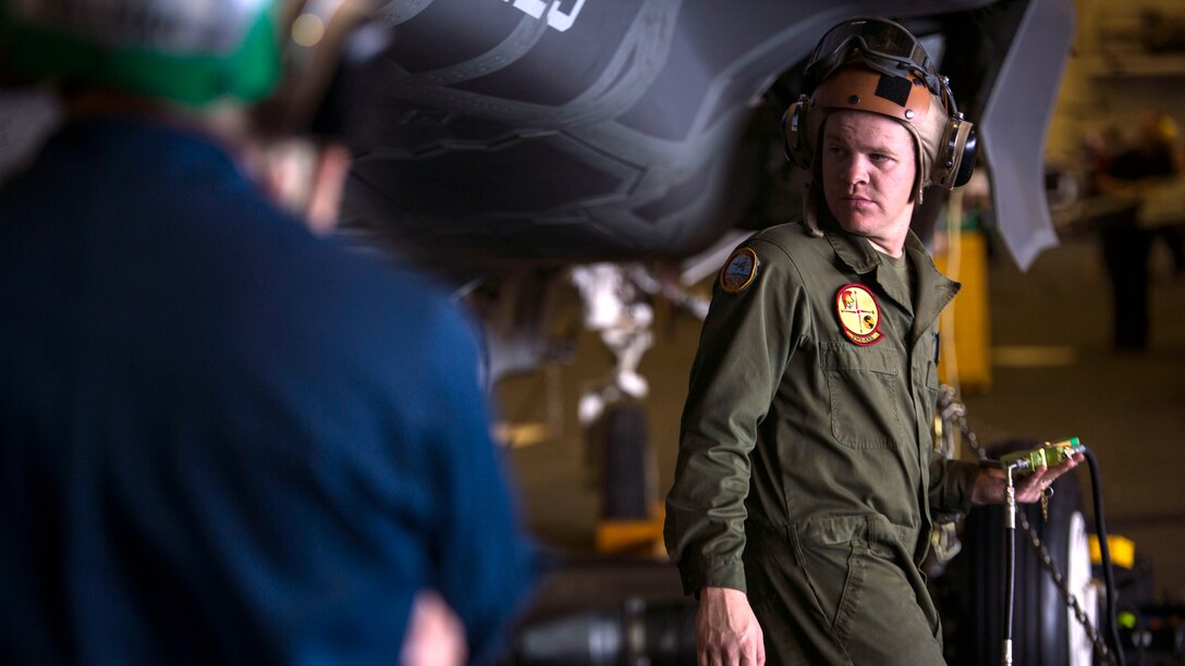 Sgt. Benjamin Mcintire, a powerline mechanic with Training and Evaluation Squadron 22, helps inflate a new tire recently put onto an F-35B Lightning II Joint Strike Fighter, aboard the USS Wasp, May 27, 2015. Marines from Training and Evaluation Squadron 22; Marine Fighter Attack Squadron 121, Marine Aircraft Group 13, 3rd Marine Aircraft Wing; and Marine Fighter Attack Training Squadron 501, Marine Aircraft Group 31, 2nd Marine Aircraft Wing all boarded the Wasp to support the Operational Training of the F-35B.