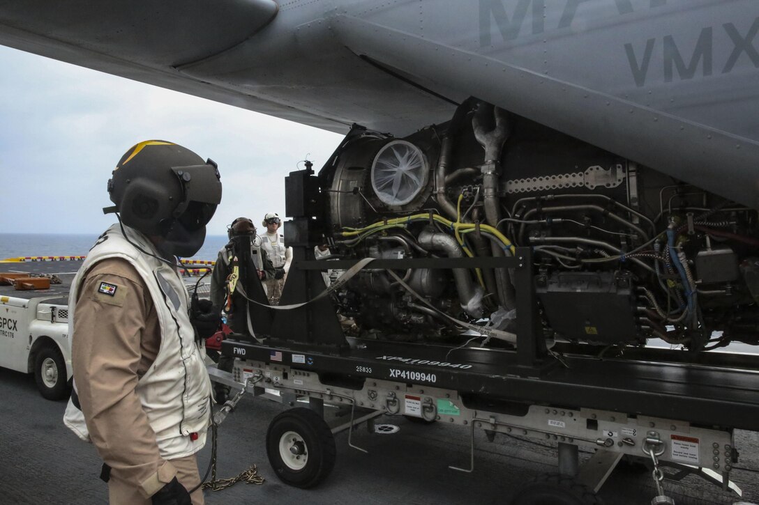 A power module for the F-35B Lightning II is moved out of an MV-22B Osprey and onto the USS Wasp, at sea May 22 during an evolution part of Operational Testing 1. OT-1 is serving the purpose of evaluating the full spectrum of F-35B measures of suitability and effectiveness, as well as assessing the integration of the aircraft into the spectrum of flight operations. 