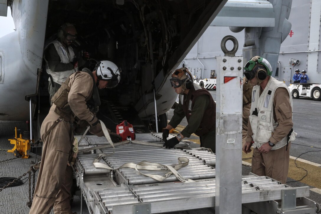 Marines prepare to move a power module for the F-35B Lightning II out of an MV-22B Osprey and onto the USS Wasp, at sea May 22 during an evolution part of Operational Testing 1. The F-35B is the future of Marine Corps aviation and will be replacing three legacy platforms; the AV-8B Harrier, the F/A Hornet, and the EA-6B Prowler.
