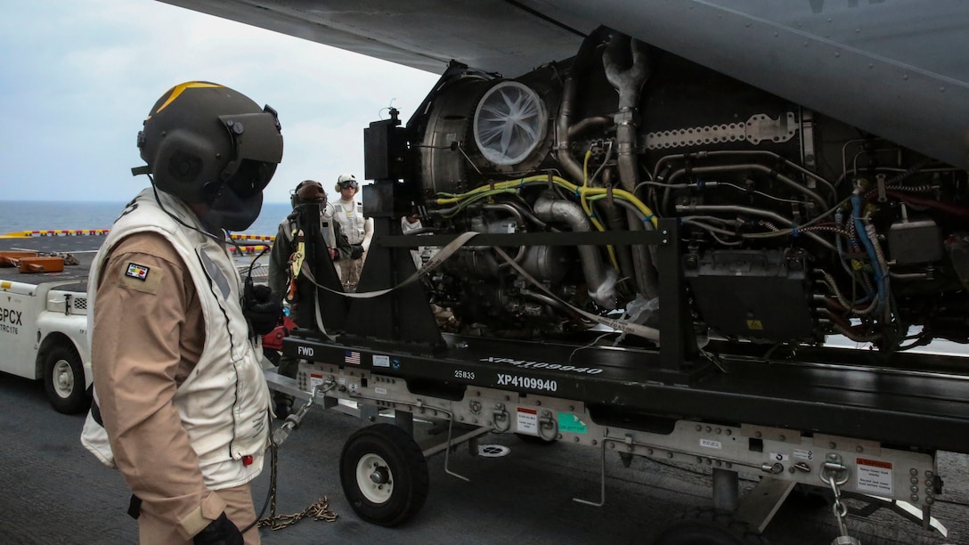 A power module for the F-35B Lightning II is moved out of an MV-22B Osprey and onto the USS Wasp, at sea May 22 during an evolution part of Operational Testing 1. OT-1 is serving the purpose of evaluating the full spectrum of F-35B measures of suitability and effectiveness, as well as assessing the integration of the aircraft into the spectrum of flight operations.
