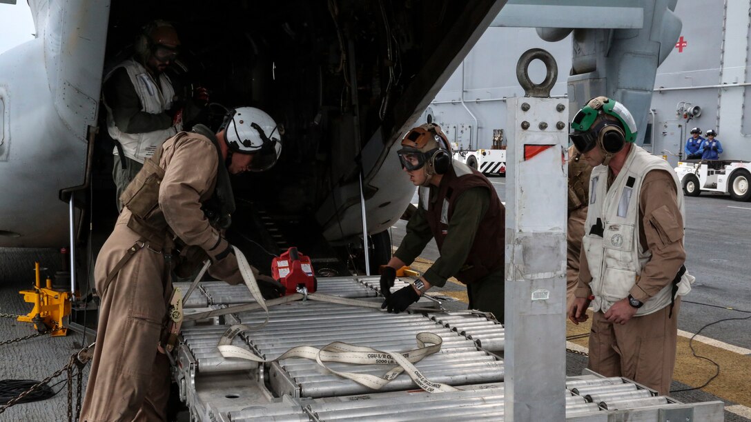 Marines prepare to move a power module for the F-35B Lightning II out of an MV-22B Osprey and onto the USS Wasp, at sea May 22 during an evolution part of Operational Testing 1. The F-35B is the future of Marine Corps aviation and will be replacing three legacy platforms; the AV-8B Harrier, the F/A Hornet, and the EA-6B Prowler.