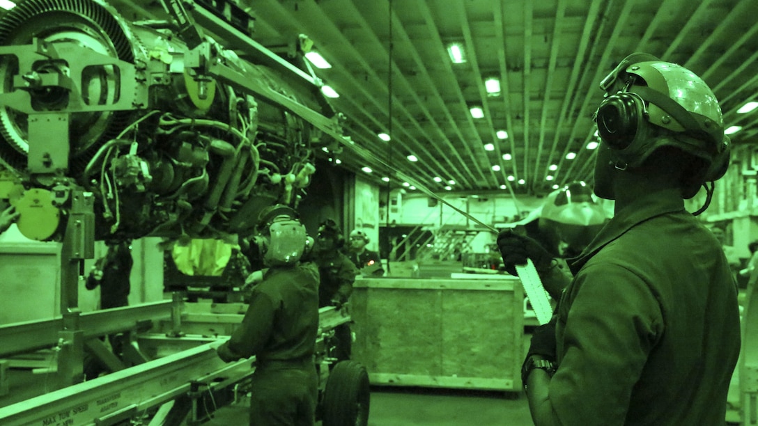 Marines with Test and Evaluation Squadron 22 move a power module for the F-35B Lightning II in the hanger bay of the USS Wasp, at sea May 23 during an evolution part of Operational Testing 1. The F-35B is the future of Marine Corps aviation and will be replacing three legacy platforms; the AV-8B Harrier, the F/A Hornet, and the EA-6B Prowler.