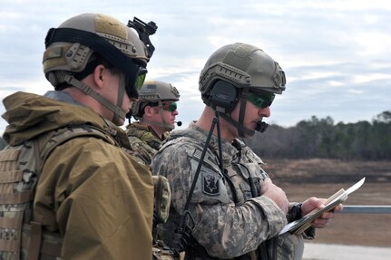 Staff Sgt. Cory Welton performs his duties as a Joint Terminal Attack
Controller on Feb. 3, 2011, during a National Guard Bureau Joint Quarterly
Training Exercise at Camp Townsend, Ga. Welton is a National Guardmember
based out of Camp Murray, Wash.