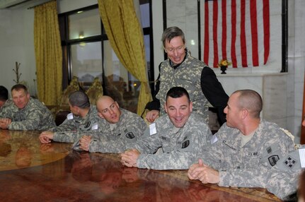 Congressman Stephen F. Lynch introduces himself to Massachusetts Army National Guardmembers from his home state during a meet and greet as part of a congressional delegation visit to Camp Victory, Iraq, Feb. 2, 2011.