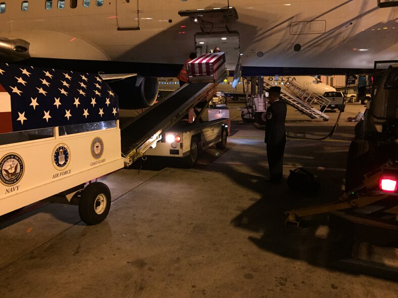 U.S. Air Force Master Sgt. Anthony J. Soupley, 312th Training Squadron Special Instruments superintendent, salutes the casket of Airman 1st Class Chris Evans, 312th Training Squadron Special Instruments student, at the Hartsfield-Jackson Airport in Atlanta, Ga., December 18, 2014. Soupley escorted Evans to his home in California, where he was buried. (Courtesy photo)