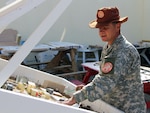 New and reliable sand tables--or terrain models--are built by Army Staff Sgt. Rene De Anda, an Illinois Guardsman with Battery A, 2nd Battalion, 123rd Field Artillery Regiment, Feb. 7, 2011 