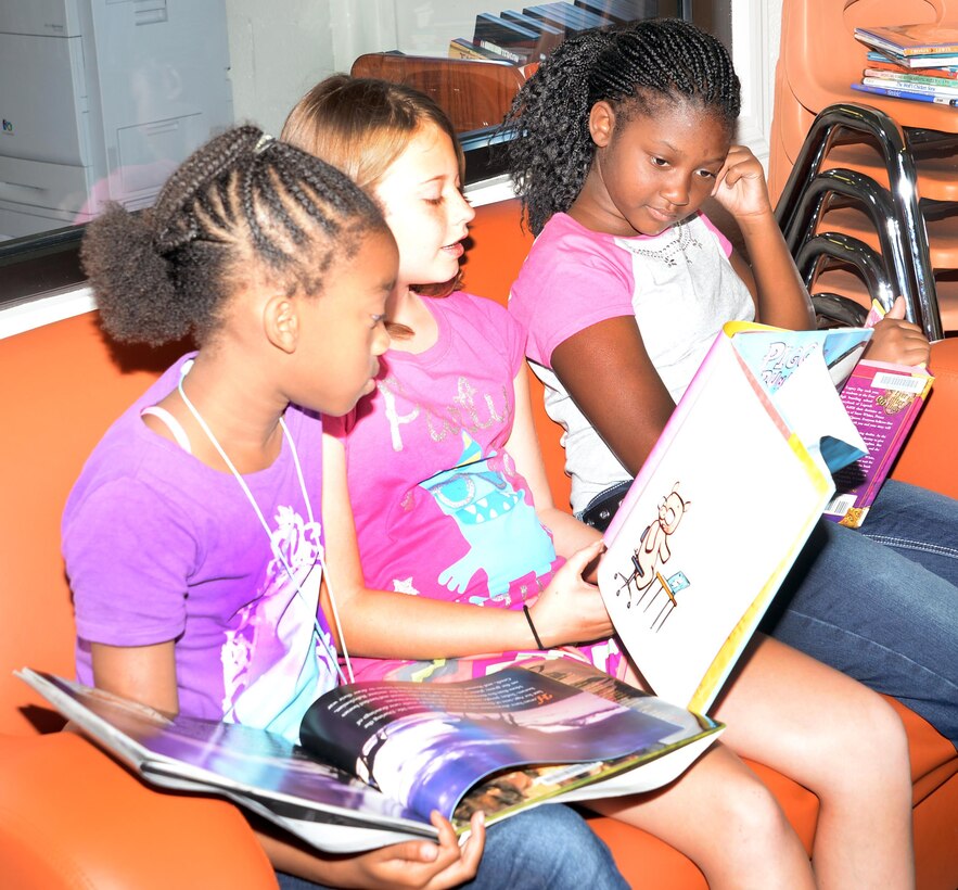Children read their favorite books in the Children's Library Room at Marine Corps Logistics Base Albany's Library during the 2015 Summer Reading Program, June 3. This year's program is themed "Read to the Rhythm."