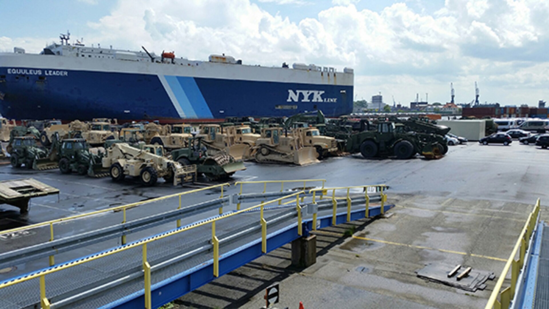 Engineering equipment from the Tennessee and Alabama National Guard is unloaded from a cargo ship in a northern German port preparing for the arrival of 1,000 military personnel to begin supporting NATO exercises.