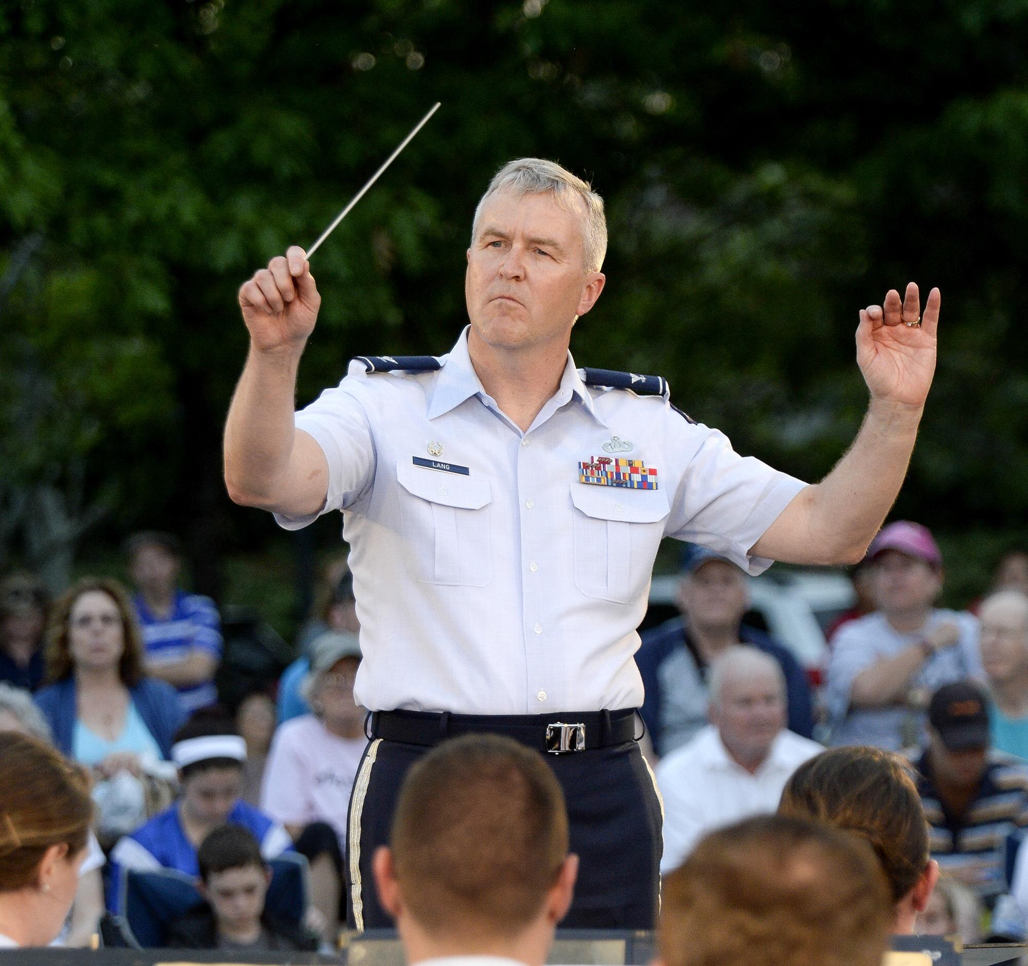 Col. Larry Lang, commander of the U.S. Air Force Band, conducts the inaugural performance of the 2015 U.S. Air Force Band Summer Concert Series at the Air Force Memorial in Arlington, Va., May 29, 2015. (U.S. Air Force photo/Andy Morataya)
