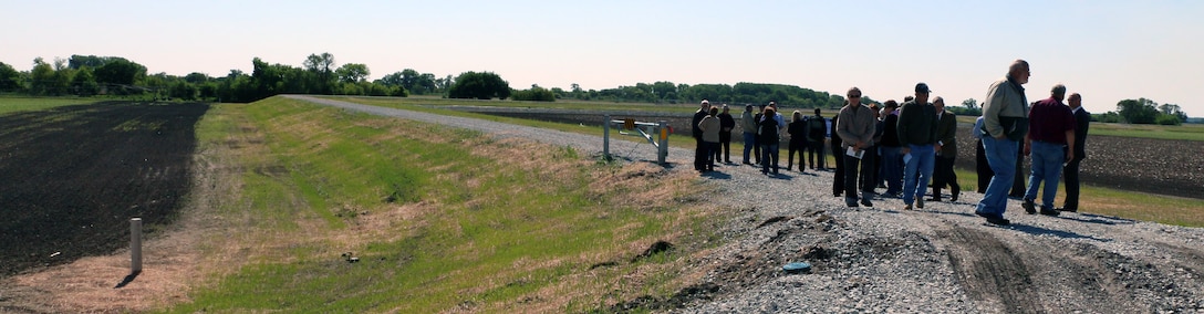 A panoramic view atop of the newly constructed levee shows the difference in elevation from the farmland beside the levee.