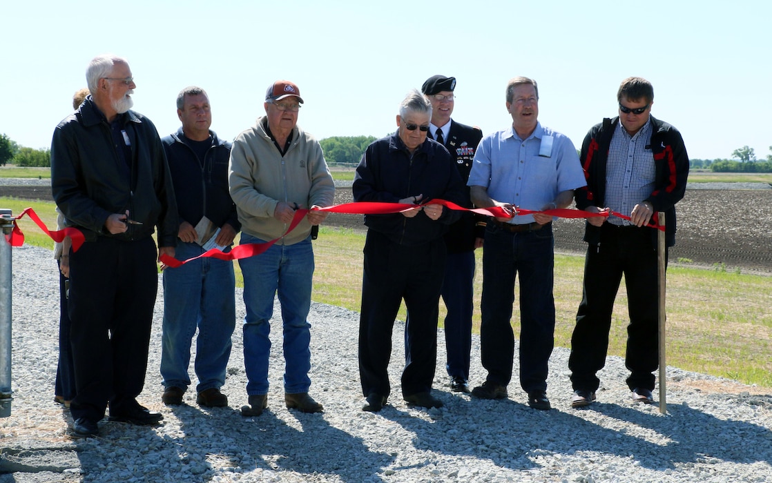 Posing at the ribbon cutting are (from the left): USACE Civil Engineer Mark Nelson, Schuyler City Council Member Ted Marxsen, Omaha District Commander Col. Cross Joel Cross, City of Schuyler Mayor David Reinecke, and Mike Murren from the Lower Platte North Natural Resources District.