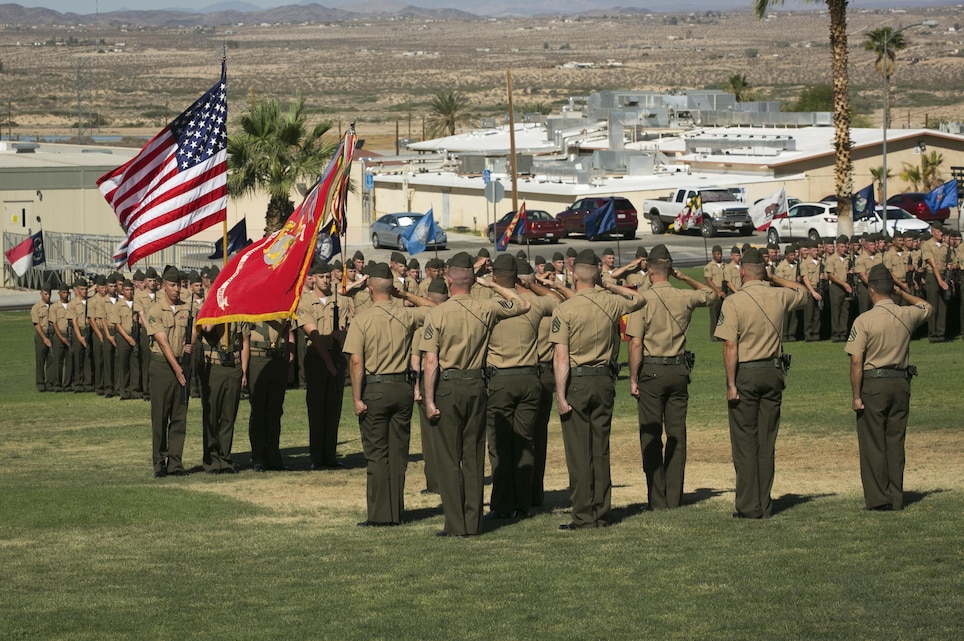 Marines with 2nd Battalion, 7th Marine Regiment, salute the colors while the national anthem is played during the battalion’s change of command ceremony at Lance Cpl. Torrey L. Gray Field, June 1, 2015. Lt. Col. Sean M. Hankard, former battalion commander, 2/7, assumed command June, 2013. (Official Marine Corps photo by Pfc. Levi Schultz/Released)