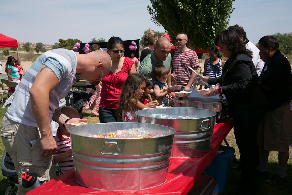 Combat Center parents and children enjoy food and refreshments after the Little Miss Lincoln Military Housing Pageant, May 30, 2015. All the participants received a sash and a tiara during the pageant. (Official Marine Corps photo by Lance Cpl. Thomas Mudd/ Released)