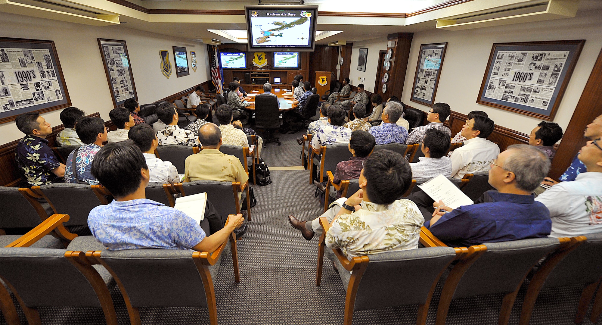 Thirty-seven people from the Forum 21 class 2015 listen to a briefing during their visit to Kadena Air Base, Japan, June 3, 2015. In addition to the Kadena mission briefing, members of the class were given a chance to ask questions and voice their concerns about Kadena’s mission. (U.S. Air Force photo by Naoto Anazawa)

