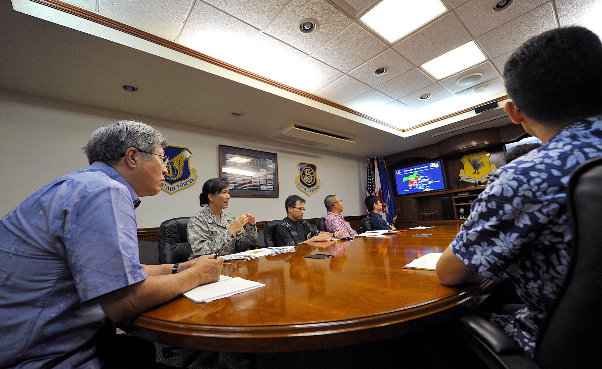 U.S. Air Force Col. Debra Lovette, 18th Mission Support Group commander, briefs members of the Forum 21 class 2015 about Kadena's mission during their visit to Kadena Air Base, Japan, June 3, 2015. The purpose of the visit is to deepen their understanding of the Japan-U.S. cooperative relationship and United States Forces, Japan. This opportunity will further strengthen the cooperative tie between Japan and the U.S. as the visitors are key personnel in shaping public opinion in Japan's private and public sectors. (U.S. Air Force photo by Naoto Anazawa)