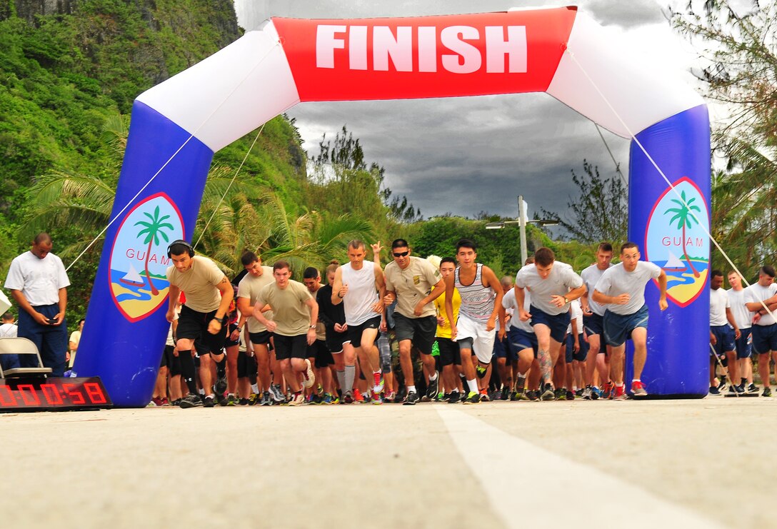 Runners take off for the Rock ‘n’ Roll 5K, June 3, 2015, at Tarague Beach on Andersen Air Force Base, Guam. Some attendees completed the run dressed in rock music-themed costumes. (U.S. Air Force photo by Senior Airman Alexander W. Riedel/Released)