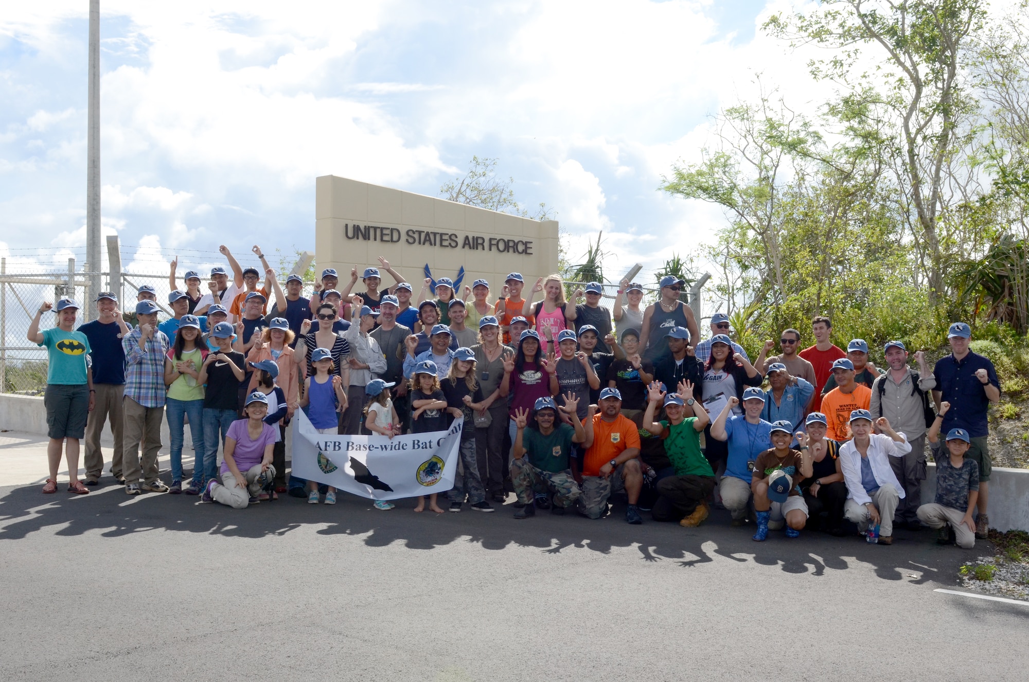 Volunteers who helped conduct the fruit bat survey pose with a banner and hold up the number of bats they saw during the survey May 30, 2015, at Andersen Air Force Base, Guam. The 36th Civil Engineer Squadron Environmental Flight worked alongside University of Guam volunteers to survey the population of federally threatened species at Andersen AFB and Northwest Field. (U.S. Air Force photo by Airman 1st Class Alexa Ann Henderson/Released)