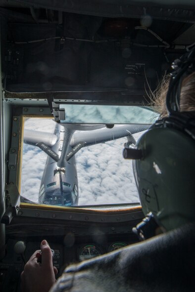 Staff Sgt. Shawna Sims, a 92nd Air Refueling Squadron KC-135 Stratotanker boom operator from Fairchild Air Force Base, Wash., refuels a B-52H Stratofortress from Minot Air Force Base, N.D., during an aerial refueling mission as part of exercise AMALGAM DART 15-2 May 28, 2015, over the Alaskan coastline. The B-52 is a long-range, heavy bomber that can perform a variety of missions and is capable of flying at high subsonic speeds at altitudes up to 50,000 feet. The KC-135 was originally designed to perform aerial refueling primarily for the B-52 when they were built in the mid-1950s and early-1960s. (U.S. Air Force photo/Staff Sgt. Benjamin W. Stratton)