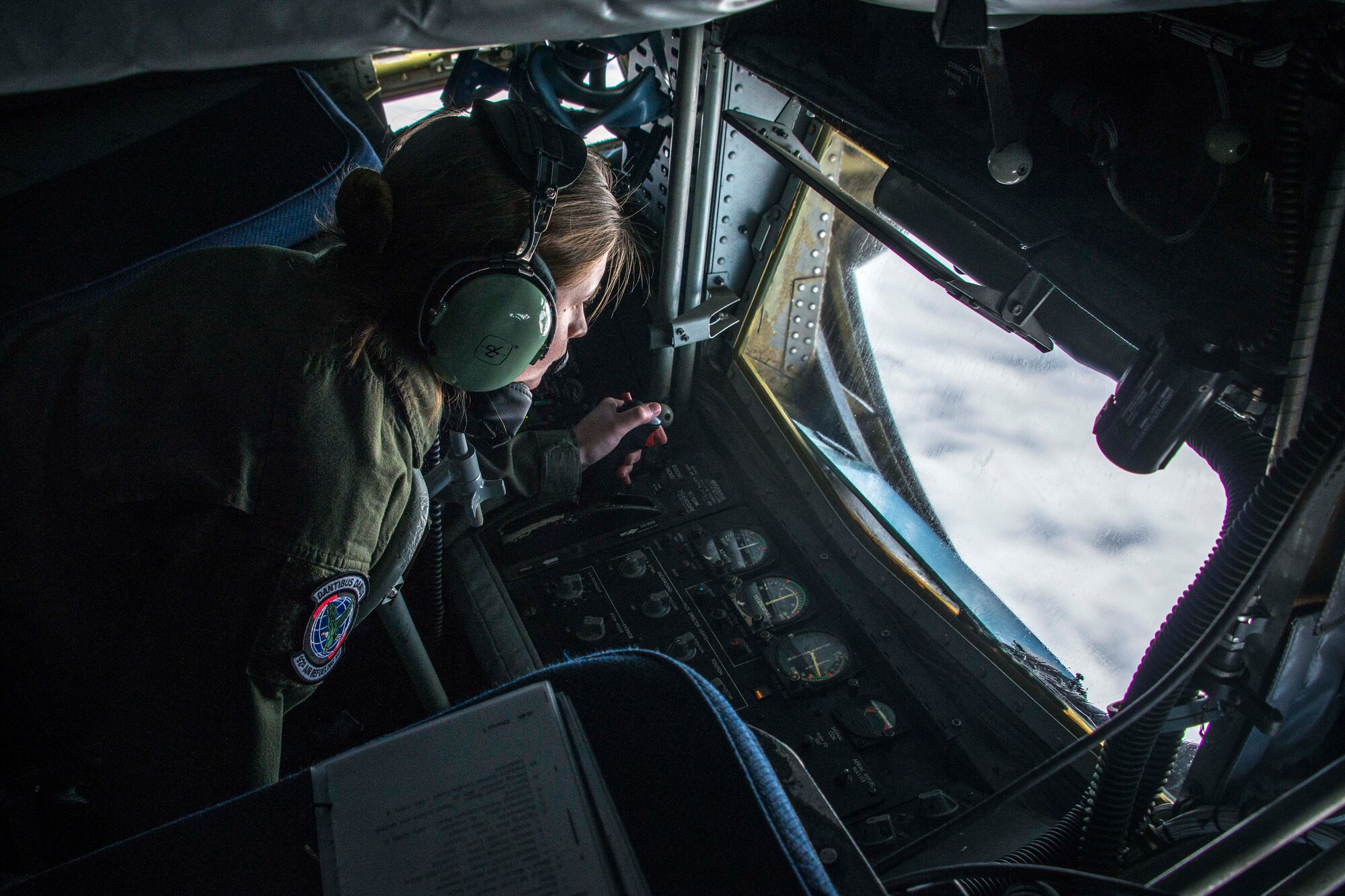 Staff Sgt. Shawna Sims, a 92nd Air Refueling Squadron KC-135 Stratotanker boom operator from Fairchild Air Force Base, Wash., connects with an F-22 Raptor fighter during aerial refueling on the way to exercise AMALGAM DART 15-2 at Eielson AFB, Alaska, May 27, 2015, over British Columbia, Canada. The exercise spanned two forward operating locations in Canada’s Northwest Territory, two U.S. Air Force bases in Alaska and a mobile radar site in Resolute, Nunavut, as well as, the skies over much of the North American Aerospace Defense Command’s area of responsibility. (U.S. Air Force photo/Staff Sgt. Benjamin W. Stratton)