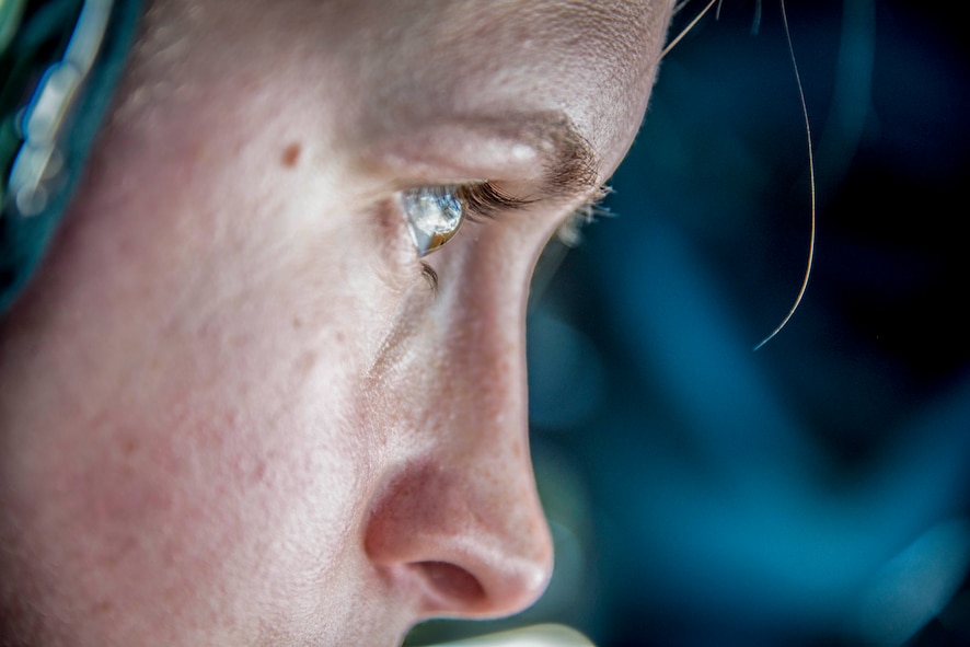 Staff Sgt. Shawna Sims, a 92nd Air Refueling Squadron KC-135 Stratotanker boom operator from Fairchild Air Force Base, Wash., coordinates with an F-22 Raptor pilot during aerial refueling on the way to exercise AMALGAM DART 15-2 at Eielson AFB, Alaska, May 27, 2015, over British Columbia, Canada. This North American Aerospace Defense Command exercise is an annual training opportunity affording American and Canadian forces field training exercises aimed at improving NORAD’s operational capability in a bi-national environment. (U.S. Air Force photo/Staff Sgt. Benjamin W. Stratton)