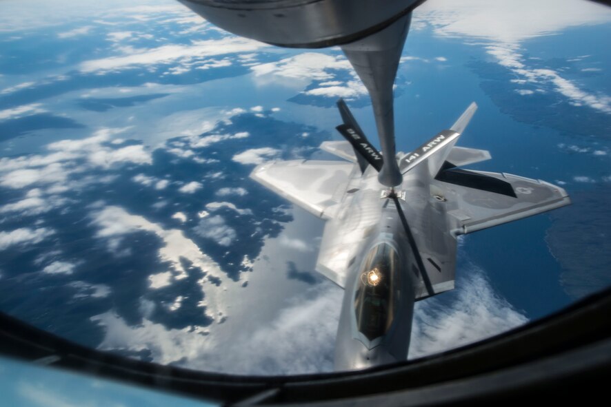 An F-22 Raptor from the 1st Fighter Wing at Joint Base Langley-Eustis receives fuel during aerial refueling from a 92nd Air Refueling Wing KC-135 Stratotanker from Fairchild AFB, Wash., on their way to AMALGAM DART 15-2 May 27, 2015, over British Columbia, Canada. A Tanker Task Force assembled from the 92nd and 22nd ARWs joined approximately 300 military personnel and 15 aircraft in exercise AMALGAM DART 15-2 May 26 through June 1. (U.S. Air Force photo/Staff Sgt. Benjamin W. Stratton)