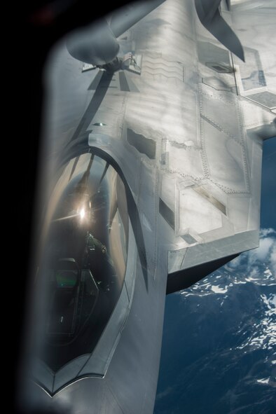 An F-22 Raptor from the 1st Fighter Wing at Joint Base Langley-Eustis receives fuel during aerial refueling from a 92nd Air Refueling Wing KC-135 Stratotanker from Fairchild AFB, Wash., on their way to AMALGAM DART 15-2 May 27, 2015, over British Columbia, Canada. A Tanker Task Force assembled from the 92nd and 22nd ARWs joined approximately 300 military personnel and 15 aircraft in exercise AMALGAM DART 15-2 May 26 through June 1. (U.S. Air Force photo/Staff Sgt. Benjamin W. Stratton)