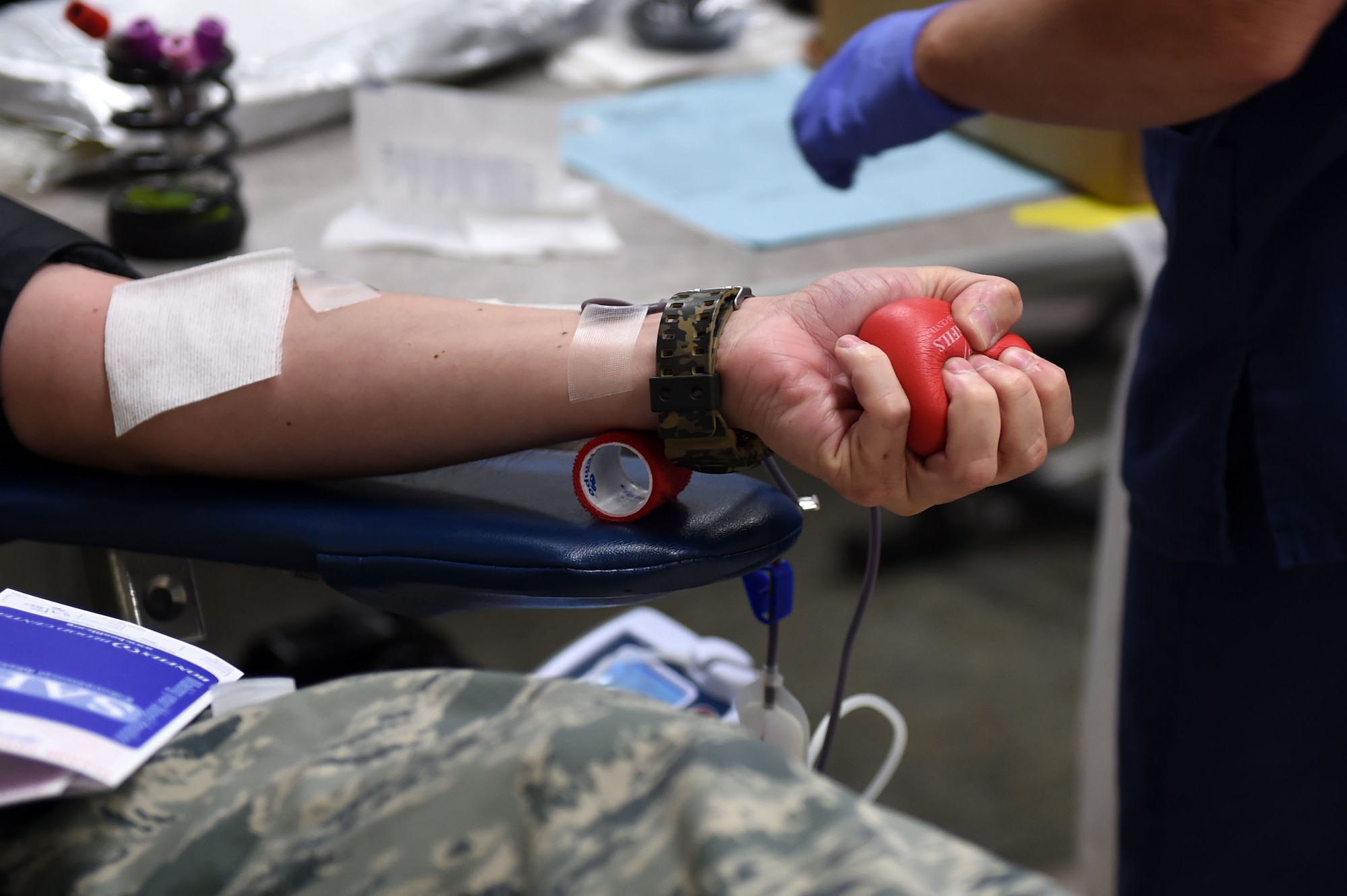 Staff Sgt. Isaac R. Salazar, 460th Space Wing plans manager, gets his blood drawn by Joyce Kissle, Bonfils Blood Bank phlebotomist, during the blood drive June 2, 2015, at the Health and Wellness Center on Buckley Air Force Base, Colo. The blood drive was to support hospitals in the local area. (U.S. Air Force photo by Airman 1st Class Emily E. Amyotte/Released)